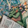 Купить  Календарь из гобелена на 2024 год "Дракон с подарком" 